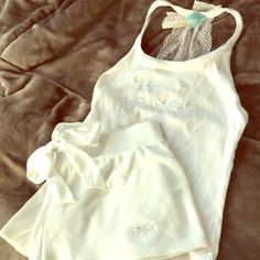 White Betsey Johnson Bride Tank And Shorts Pajama Set With Rhinestone And Lace Detail. Once Worn Once. Tank Top Size Small, Shorts Size Medium. Perfect Condition White Matching Set Tops For Loungewear, Fitted Lace Trim Loungewear Set, Cotton Wedding Sets With Lace Trim, Wedding Sets With Lace Trim In Cotton, White Stretch Sleepwear For Pajama Party, White Stretch Sleepwear, White Matching Set Tops For Pajama Party, White Stretch Pajama Shorts For Sleep, White Sets With Lace Trim For Pajama Party