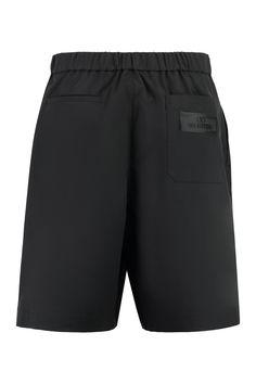 Indulge in the ultimate comfort and style with these luxurious Bermuda shorts. Crafted with a blend of high-quality materials, including polyester and elastane, these shorts offer a perfect combination of durability and flexibility. The elastic back waist insert ensures a snug and comfortable fit, while the iconic logo patch adds a touch of designer flair. Whether you're running errands or lounging at home, these Bermuda shorts are the perfect addition to your upscale casual wardrobe. Elevate yo Valentino Logo, Influential Women, Valentino Black, Famous Designers, Leather Cap, Black Nylons, Denim Top, Casual Wardrobe, Womens Clothing Tops