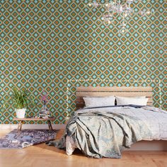 a bed sitting on top of a wooden floor under a chandelier