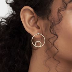 The Shimmering Loop Bardot Hoops are artistic and minimalistic. They're made with solid gold and ethically sourced natural diamonds, adding a touch of shimmer to any outfit. The loop design adds an element of movement to the hoops, making them a dynamic addition to your jewelry collection. Gold Diamond Earrings Brilliant Cut Minimalist Style, Gold Diamond Earrings With Brilliant Cut, Minimalist Style, Timeless Gold Diamond Earrings With Pave Setting, Gold Minimalist Diamond Earrings With Brilliant Cut, Gold Minimalist Brilliant Cut Diamond Earrings, Modern Gold Earrings With Pave Setting, Modern Gold Diamond Earrings With Pave Setting, Modern Everyday Diamond Earrings With Accents, Gold Diamond Earrings With Single Cut For Everyday Luxury