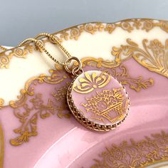 Beautiful and elegant victorian china!  Broken china jewelry is a lovely traditional china gift to celebrate your 20th wedding anniversary with your wife. She will love her handmade jewelry carved from vintage china and set in 14k solid gold!  Our handmade and repurposed china pendant is 7/8" round. From top of bail to bottom of pendant is 1 3/8" tall. Have questions or want more photos? I'll be happy to provide them. DinnerWear Jewelry® ~ Specializing in one of a kind pieces since 1998. Our individually hand crafted pieces are 100% guaranteed. SHIPPING : We ship worldwide from the USA. Expedited shipping available upon request. Free shipping in USA.  JOIN THE DINNERWEAR FAMILY!  Our monthly newsletter features special Etsy sales and incredible custom order stories. Copy this link into you Victorian Round Necklace For Ceremonial Occasions, Victorian Round Ceremonial Necklaces, Victorian Round Necklaces For Ceremonial Occasions, Victorian Style Ceremonial Necklace, Victorian Hallmarked Necklace For Wedding, Victorian Hallmarked Necklaces For Wedding, Victorian Gold Wedding Jewelry, Victorian Gold Jewelry For Wedding, Cameo Round Pendant Necklace For Wedding