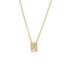 This Emerald Gold Frame Solitaire Pendant Necklace features an emerald cut diamond totaling approximately 0.21 carats framed in 18K yellow gold. Elegant Gold Emerald Necklace With Brilliant Cut, 14k Gold Emerald Cut Solitaire Necklace, Formal Emerald Cut Diamond Necklace, 14k Gold Solitaire Necklace With Emerald Cut Diamond, 14k Gold Necklace With Emerald Cut Diamond Accents, Timeless 14k Gold Emerald-cut Necklace, Radiant Cut Baguette Diamond Gold Jewelry, Formal Gold Emerald Necklace With Single Cut Diamonds, Luxury 14k Gold Emerald Cut Diamond Necklace