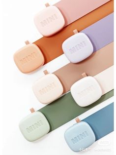 five different colors of pastel soaps with the word mint written on one side