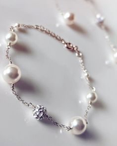 A simple, understated, beautiful bracelet made with high quality Swarovski pearls. The matching earrings are also available, this listing is for the bracelet only. Please see the links further below for the matching items. Available in 925 sterling silver (SS). The bracelet measure only 16.5cm in length + 2cm chain extension. The full length of the bracelet is 18.5cm. Most suitable for SMALL & MEDIUM wrist size. Please bear in mind that the pearls needs some space therefore the bracelet might no Elegant Bracelet Jewelry For Bridesmaid Gift, Elegant White Sterling Silver Bracelet For Anniversary, Elegant Sterling Silver Pearl Bracelet As Gift, White Gold Sterling Silver Pearl Bracelet For Anniversary, Silver Pearl Beaded Bracelets Minimalist Style, Minimalist Sterling Silver Pearl Bracelet For Wedding, Sterling Silver Pearl Drop Bracelet For Anniversary, Silver Pearl Drop Bracelet For Party, Round Sterling Silver Wedding Bracelet