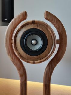 a wooden speaker on top of a table