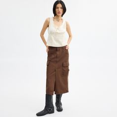 A ‘90s-inspired take on vintage utilitarian styles this maxi cargo skirt is designed with traditional workwear pockets to hold your on-the-go essentials. Crafted of organic cotton made without the use of harmful chemical fertilizers and pesticides the long silhouette is finished with a front vent for added mobility and tie details at the hem. Utility Skirt With Side Pockets For Fall, Fall Utility Skirt With Side Pockets, Utility Denim Skirt With Cargo Pockets, Fall Utility Cargo Skirt With Pockets, Fall Cargo Skirt For Work With Multiple Pockets, Fall Cotton Skirt With Cargo Pockets, Utility Style Long Skirt With Cargo Pockets, Fall Cotton Cargo Skirt With Pockets, Spring Utility Skirt With Cargo Pockets