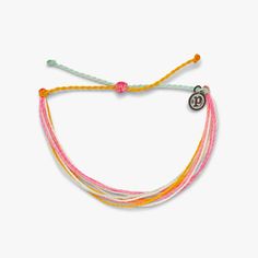 Pura Vida multi strand corded bracelet in varying shades of pink, white, and orange with a Pura Vida logo charm Cute Charm Bracelets Pura Vida, Puravida Bracelets Diamond, Charms For Bracelets Pura Vida, Pura Vida Bracelets Dreaming Outloud Set, Puravida Bracelet Sets, Turquoise Jewelry Pura Vida, Sunflower Jewelry Pura Vida, Preppy Bracelets Pura Vida, Puravida Bracelets Bead