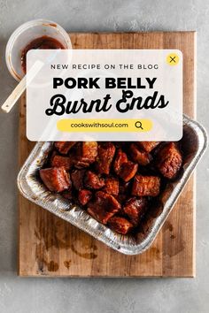 pork belly burnt ends on a wooden cutting board