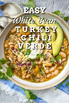 bowl of white bean turkey chili verde topped with slices of avocado, sour cream and shredded cheese Turkey Kale Chili, Easy Healthy Turkey Chili, Turkey And Bean Chili, White Chili Turkey Recipe, White Chili With Ground Turkey, Ground Turkey White Chili, Green Turkey Chili, Turkey Chili Verde