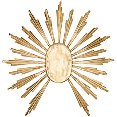 a gold sunburst wall decoration on a white background