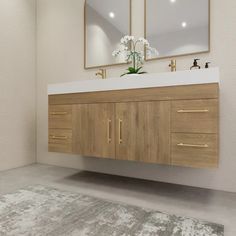 a bathroom vanity with two mirrors above it and a rug on the floor in front of it