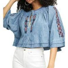 Floral Embroidery Adds Charm And Texture To This To From Free People, Accented With Elbow-Length Flare Sleeves And A Split Neckline. Product Details Pullover Split Neck With Tie Elbow Flare Sleeves Imported Measurements Shown In The Pictures Bohemian Denim Top For Spring, Spring Embroidered Cotton Denim Top, Summer Embroidered Blue Denim Top, Blue Denim Top With Floral Embroidery For Spring, Embroidered Denim Blue Top For Summer, Embroidered Cotton Tops For Spring, Floral Embroidered Denim Top For Summer, Summer Embroidered Denim Top, Summer Denim Top With Floral Embroidery