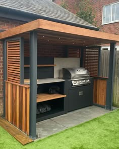 an outdoor kitchen with grill and barbecue area