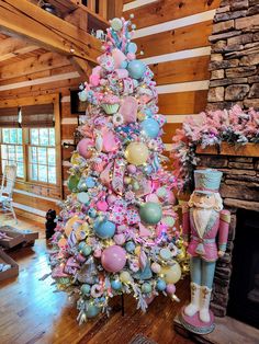 a pink and blue christmas tree in a living room