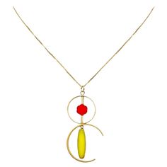 The pendant consist of yellow oblong and flower shaped beads and finished with a 16 inch gold filled chain. The beads are new old stock vintage German glass beads that are framed with 24K gold. The beads were hand pressed during the 1920s-19760s. No two beads are exactly alike. These beads are no longer in production thus making them rare and collectible. Due to the nature of this jewelry, it is unique. Product Detail: 24K gold edge German vintage glass Bead 24K gold-plated brass metals 14K gold Handmade Gold Oblong Jewelry, Glass Necklaces With Gold Beads As A Gift, Glass Necklaces With Gold Beads For Gift, Handmade Gold Pendant Long Necklace, Gold Handmade Pendant Long Necklace, Handmade Oblong Gold Jewelry, Modern Handmade Gold Necklace, Modern Gold Necklace With Beaded Chain, Unique Gold Necklace With Rectangular Pendant