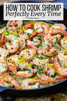 a skillet filled with cooked shrimp and garnished with parsley on the side