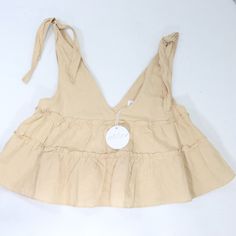 Brand New With Tag Petal + Pup Shirt Women's Us Size 8 Au Size 12 Beige Like Color, Sleeveless Tank Top, Straps Tie At Shoulders, Flowy Looser Style, Tiered Look, Deep V Neck 55% Linen 45% Cotton Cute Beige V-neck Top, Casual Beige Top With Ruffles, Summer Cotton Crop Top For Brunch, Solid Color Cotton Crop Top For Vacation, Beige Cotton Ruffle Tops, Beige Cotton Tops With Ruffles, Cute Ruffled Crop Top, Feminine Beige Crop Top For Summer, Sleeveless Cotton Top For Brunch