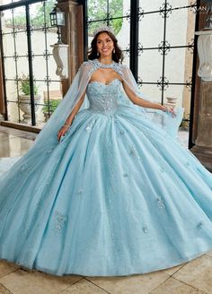 Make an impact in this embroidered applique long strapless cape dress with A-line skirt by Rachel Allan RQ1162. The sweetheart bodice, intricately beaded and adorned with shimmering appliqué details, enhances your natural elegance. With a detachable bodice liner, this gown is perfect for quinceañeras or grand celebrations, ensuring you radiate grace and beauty on your special day. Strapless Cape Quinceanera Dress by Rachel Allan RQ1162 Rachel Allan Carmina Collection: Spring 2025 Style Number: R Cinderella Quinceanera Dresses, Cinderella Quinceanera Dress, Cinderella Quinceanera, Blue Quinceanera Dresses, Tulle Applique, White Dress Styles, Backless Dress Short, Mary's Bridal, Quince Dresses Red