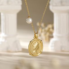 Carry a little history with our beloved Queen Elizabeth II Portrait Coin Pendant Necklace. This unique and modern designed sterling silver necklace is versatile and reversible to suit every occasion. It has a Queen Elizabeth portrait on one side, and the "Saint George Killing the Dragon" on the other. It is easy to coordinate with your outfits and other jewelry without having to overthink it. Just put it on and you are good to go!Carat Weight: 1.5 ctStone Shape: RoundStone Size: 6 mmNumber of St Elegant Sterling Silver Pendant Coin Necklace, Elegant Sterling Silver Coin Pendant Necklace, Luxury Silver Coin Necklaces, Elegant Sterling Silver Coin Necklace With Round Pendant, Classic Sterling Silver Medallion Necklace Gift, Classic Sterling Silver Medallion Necklace As A Gift, Elegant Sterling Silver Medallion Coin Necklace, Sterling Silver Medallion Necklace With Pearl Pendant, Luxury Sterling Silver Necklace With Coin Pendant