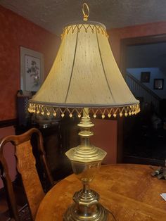 a table lamp sitting on top of a wooden table