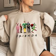 This Friends Christmas Ugly Sweatshirt is a must-have for your winter/Christmas wardrobe. Whether you're attending a Christmas party, staying cozy at home with family and friends, or simply need collecting more sweater-weather crewnecks, this unisex sweatshirt is perfect for you! Our crewnecks are made from the highest quality fabric for an incredibly soft and comfortable fit, with advanced printing and embroidery to ensure that the colors and graphics are vibrant and detailed. ❤ This unisex crewneck sweatshirt is intended to be oversized and loose-fitting for women for a chic and laid-back vibe. If you want something more fitted, we suggest ordering a size down! ❤ How to order your Sweaters: 1. Select the desired Sweater Style/Sweater Color 2. Select the desired Sweater Size 3. Add each s Fun Winter T-shirt With Crew Neck, Fun Crew Neck T-shirt For Winter, Fun Winter Crew Neck T-shirt, Casual Christmas Cotton Sweatshirt, Casual Cotton Christmas Sweatshirt, Winter Fun Relaxed Fit Tops, Fun Winter Tops With Relaxed Fit, Fun Winter Sweatshirt With Letter Print, Fun Crew Neck Winter Tops