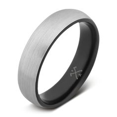 a black and white wedding band with the cross engraved on it, is shown in stainless steel