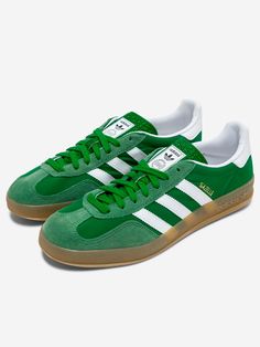 A remake of the 1979 Gazelle Indoor, the sneakers most favored by soccer fans and sneakerheads alike. A green suede upper and durable leather lining combine with a translucent rubber outsole. The 3 stripes and metallic lettering complete the iconic look.   Suede upper  Lace-up closure  Leather lining  Rubber sole  Green / Cloud White / Hazy Green   Size & Fit: Fit regular Adidas Gazelle Indoor, Adidas Originals Gazelle, Trendy Bracelets, Soccer Fans, Cloud White, Boot Pumps, Green Suede, Adidas Gazelle, Dream Shoes