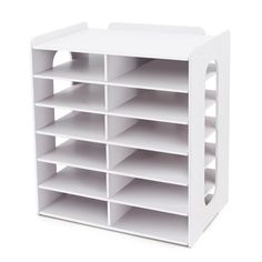 a large white shelf with many compartments