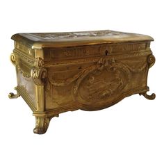 an ornately carved gold chest is shown