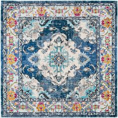 a blue and white area rug with an ornate design on the center, surrounded by multicolored flowers