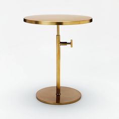 a round table with a gold metal base