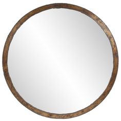 a round mirror hanging on the wall in front of a white background with a wooden frame