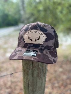 Our Richardson 112 trucker hat is the perfect addition for you next hunting trip! The snap back adjustment allows for the perfect fit. Our cow hide engraved leather is stitched on to the hat for a finished and secure look. Need a custom logo for your hunting club, send us a message Country Style Trucker Hat With Curved Brim For Outdoor, Country Style Trucker Hat With Curved Brim, Brown Snapback Trucker Hat For Hiking, Country Style Trucker Hat With Curved Bill For Outdoor, Rustic Outdoor Cap, Brown Hunting Hat With Leather Patch, Country Style Snapback Hat With Curved Brim For Outdoor, Country Style Brown Baseball Cap For Outdoor, Country Style Baseball Cap For Outdoor