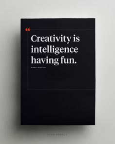 a black book with white lettering on the front and back cover that reads creativity is inteliligence having fun