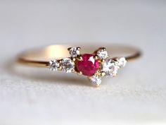 Ruby engagement ring, Genuine ruby ring, Cluster engagement ring, Ruby cluster ring, Cluster ring with ruby and diamond, Ruby ringAvailable in 9k/14k/18k yellow, rose or white gold. Same design can be made also with other custom gemstones per request. Product details:- Solid gold- Diamond - 1.5mm, 2mm, 2.5mm, Ruby - 3mm- 1.1mm band- Diamond clarity - VS, Color - E-FRing size - US 3 to US 9 (for smaller or larger ring size, please contact)Please select your size at the drop down menu. Service Ava Cluster Diamond Ring With Birthstone For Gift, Cluster Diamond Ring With Birthstone As Gift, Cluster Birthstone Diamond Ring For Gift, Cluster Ruby Ring With Accent Stones For Wedding, Red Cluster Diamond Ring For Wedding, Wedding Ruby Cluster Ring With Accent Stones, Wedding Cluster Ruby Ring With Accent Stones, Cluster Birthstone Rings For Weddings, Wedding Cluster Rings With Birthstone