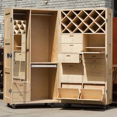 an open cabinet sitting in front of a building