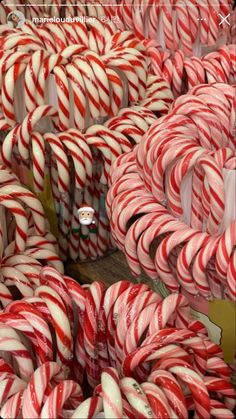 many candy canes are stacked on top of each other