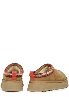 Long Description#Info & Care# Ugg suede mules  Flatform measures approximately 1.5 inches/ 40mm  Water-resistant, embroidered piped trim, grosgrain heel tab, designer-stamped side, shearling lining, seam detail, rubber outsole suitable for outdoor wear, round toe  Slips on  #Size & Fit# Only available in full sizes, go up to the nearest whole size if you take a half size Ugg Tazz, Platform Mules, Suede Mules, Go Up, Outdoor Wear, Chestnut, Take A, Water Resistant, Top Brands