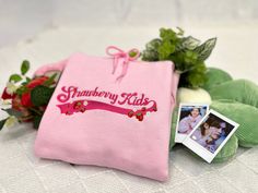 Hello, this is our Strawberry Kids Hoodie! We loved seeing Stray Kids participate in the Sports Day episode on Kingdom & brought this design to life in honor of the cute pink fits from that day!! Hope you enjoy the sweet & cozy strawberry design! 🍓 Cute Cotton Hoodie With Custom Embroidery, Pink Long Sleeve Hoodie With Embroidered Logo, Cute Hooded Sweatshirt With Embroidered Graphics, Pink Long Sleeve Hoodie With Custom Embroidery, Casual Pink Hoodie With Letter Embroidery, Cute Hooded Hoodie With Embroidered Logo, Cute Winter Hoodie With Embroidered Graphics, Cute Embroidered Graphics Hoodie For Winter, Casual Pink Hoodie With Embroidered Graphics