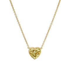 Drape yourself in luxury with our Certified 18k Yellow Gold Heart Shape Yellow Diamond Pendant. This exquisite piece features a captivating yellow diamond meticulously crafted into a heart shape, symbolizing love and opulence. Set in radiant 18k yellow gold, the pendant adds a touch of warmth and sophistication to any ensemble. The diamond is certified for its exceptional quality, ensuring enduring beauty. Luxury Yellow Gold Heart-shaped Diamond Necklace, Yellow Heart Cut Fine Jewelry, Heart Shaped Yellow Jewelry For Wedding, Heart-shaped Yellow Jewelry For Weddings, Luxury Yellow Necklaces For Anniversary, 14k Gold Heart-shaped Yellow Jewelry, Yellow 14k Gold Heart Jewelry, Heart-shaped 14k Yellow Gold Jewelry, Yellow Gold Heart Necklace With Brilliant Cut Pendant