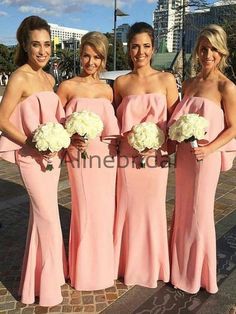 the bridesmaids are all wearing pink dresses and holding bouquets in their hands