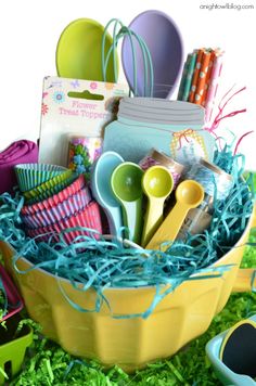 an easter basket filled with eggs and colorful utensils