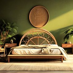 a bed in a room with green walls and plants on the wall behind it is a rattan headboard