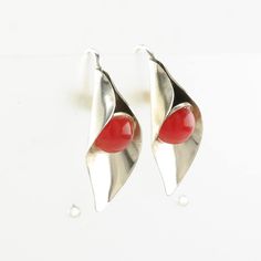 "These vintage sterling silver earrings are 1 1/8\" long, and 9/16\" wide The earrings weigh 5.3 Grams The Stone/Theme is Red Stone, Calla Lily  Size/Stone measurement (if any) are 8.9 mm Markings: Sterling, (Tested Sterling Silver guaranteed to be so) The condition of the earrings is Estate, Great, very light gluing visible, light patina Extra Note: Circa 1940 More unique vintage Silver earrings: https://www.etsy.com/shop/SilverStarrs925?section_id=13899305 NOTE: Variations in color in the pictures are due to reflections. The color in person is a beautiful even silver. Thank you for viewing my item!" Red Round Earrings With Polished Finish, Classic Red Nickel-free Earrings, Red Polished Earrings For Gift, Classic Red Sterling Silver Earrings, Red Metal Earrings For Anniversary, Red Sterling Silver Jewelry With Polished Finish, Nickel-free Red Earrings For Anniversary, Classic Sterling Silver Wrap Earrings As Gift, Classic Sterling Silver Wrap Earrings For Gift