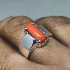 "Red Coral /Moonga 4.00-11.00 Ct. Stone 92.5 Sterling Silver Ring For Men & Women. This ring is suitable for Men & Women having ring sizes between 4.25 to 12.00 as per US ring standards. Size of this ring is easily by hand. Fine quality Red Coral is used to give best results for your astrological needs. Stone will be neat and clean without blemishes. Gemstone is left open from the back side. Gemstone certified by a Well reputed laboratory. This fashionable flat Rings band is dainty and e Concave Gemstone Rings As Gift, Unique Orange Jewelry For Anniversary, Unique Sterling Silver Ring With Rectangular Stone, Modern Orange Rings For Gifts, Modern Orange Rings For Gift, Modern Orange Rings As Gifts, Silver Ring With Large Rectangular Stone, Silver Rings With Large Rectangular Stone, Orange Sterling Silver Promise Ring Jewelry