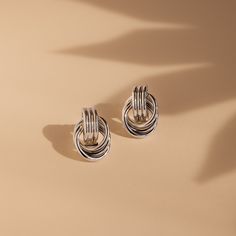 ⚡️Trending Alert: Popular and in high demand ⚡️ Indulge in everyday luxury with our Mini Triple Knot Earrings, designed to add a touch of sophistication to any outfit! Perfect for daily wear, these earrings are an essential addition to your collection, offering timeless elegance everyday. Finish/Material: 18K Gold Over Brass ∙ White Gold Over Brass ∙ Mixed Metal Featuring dainty ~19x12mm Double Hoop Knot Stud Earrings Sold as a Pair Part of our Everyday Essentials Collection Model showcases a de Knot Stud Earrings, Knot Studs, Everyday Luxury, Punk Jewelry, Knot Earrings, Everyday Luxuries, Stainless Steel Earrings, Earrings Collection, Elegant Earrings