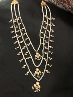 Kundan Pearl Drop Necklace For Diwali Gift, Bollywood Kundan Necklace With Pearl Drop For Gifts, Kundan Pearl Drop Necklace For Gift, Kundan Pearl Drop Necklace As Gift, White Kundan Chandbali Pearl Necklace, Pearl Kundan Necklace With Tilla For Gift, Pearl Drop Kundan Necklace For Diwali, Bollywood Kundan Necklace With Pearl Drop, White Kundan Necklace With Pearl Drop For Festivals