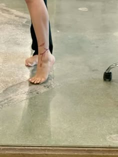 a person standing on top of a wet floor