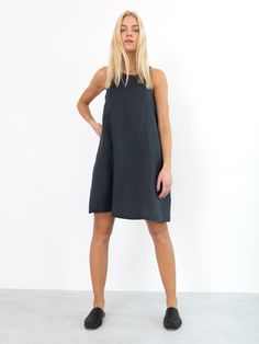 "LILY is a sleeveless midi dress inspired by 1960s mod style. Cut in slight flare shape to be worn floaty. DETAILS - High neckline - Sleeveless design - Knee length - Oeko-Tex certified 100% local washed midweight linen - Cut and sewn to order just for you in our studio COLOR - Dark Grey, you can also choose other colors above - Fabric samples are available here https://www.etsy.com/listing/586569696/linen-fabric-samples SIZING & FIT - Fits true to size - Length (shoulder to hem) is approxim Midi-length Slip Dress For Summer Workwear, Midi Length Slip Dress For Summer Workwear, Summer Midi Slip Dress For Workwear, Casual Workwear Dress With Straight Neckline, Summer Workwear Sleeveless Slip Dress, Summer Workwear Mid-length Mini Dress, Sleeveless Slip Dress For Summer Workwear, Summer Mid-length Mini Dress For Work, Sleeveless Slip Dress For Spring Workwear