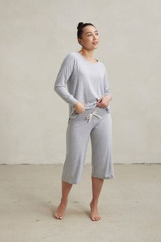 Your Comfort Uniform. Our soft and flattering raglan sleeve relaxed long sleeve top paired with our capri pants with a wide soft stretch waistband and adjustable drawstring closure. Made from our signature ultra-soft and moisture-wicking fabric blend. Includes a Relaxed Long Sleeve Top and Capri Pants. Made in Canada. 93% Viscose from Bamboo / 7% Spandex. XS (0-2), S (0/2-4/6), M (6-8/10), L (10-12/14), XL (14-16/18), XXL (18-20/22). Machine washable & dryer friendly. Fabric patterns designed by Spring Relaxed Fit Activewear For Lounging, Versatile Spring Activewear For Lounging, Relaxed Fit Spring Activewear For Relaxation, Versatile Spring Activewear For Loungewear, Relaxed Fit Activewear For Spring Relaxation, Casual Tops With Elastic Waistband For Relaxation, Loungewear Capris With Elastic Waistband, Casual Activewear Long Pants For Relaxation, Casual Long Pants Activewear For Relaxation